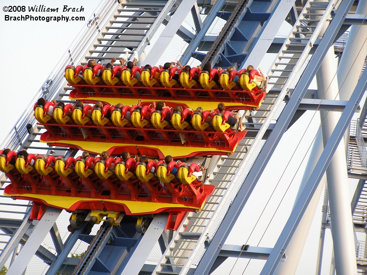 Here's one of the griffon trains making its way up the lift hill.  The trains on Griffon are short, only 3 rows, but they're very wide.  Each train holds 30 peeps.  10 peeps per row, 3 rows of cars.