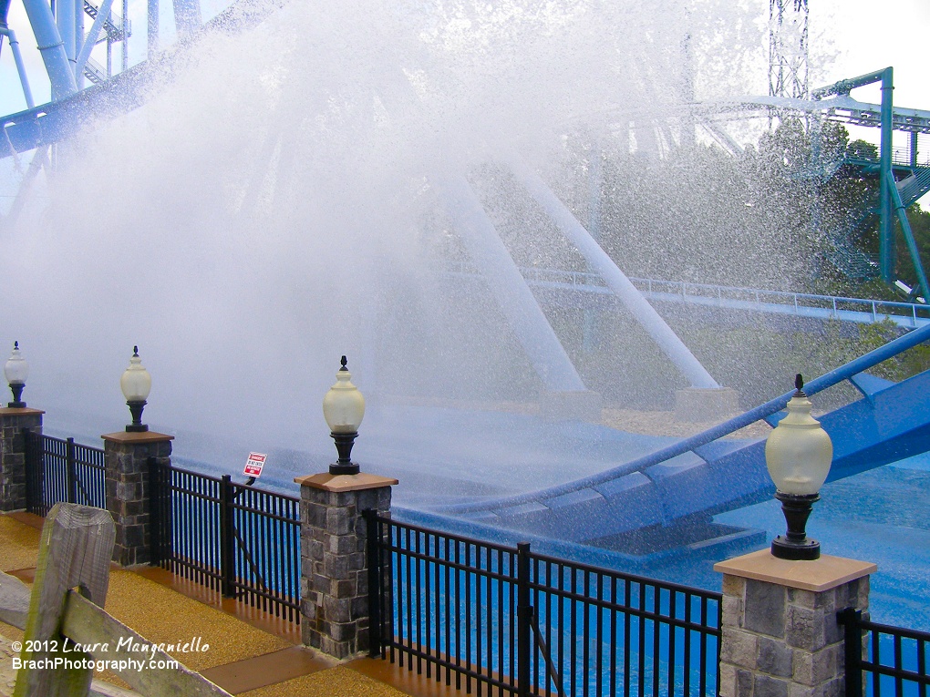 Water falling back down after a train had gone through the pool and scooped some up into the air.