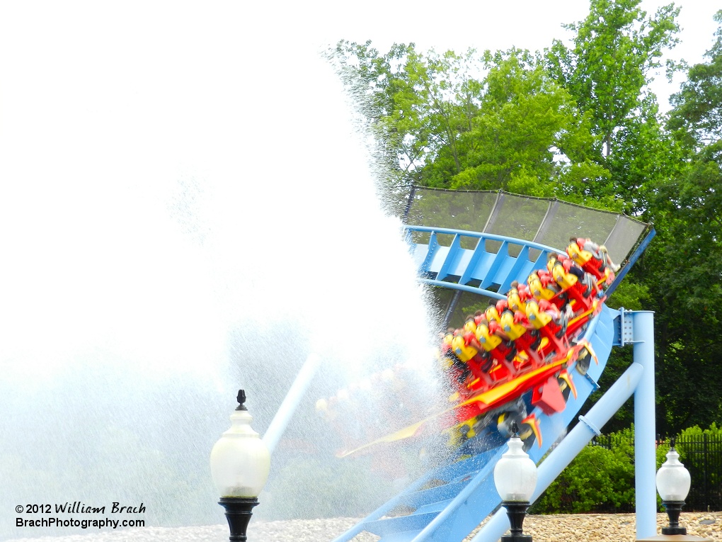 Griffon train exiting the splash pool, entering the final turn on the ride before entering the final brake run.