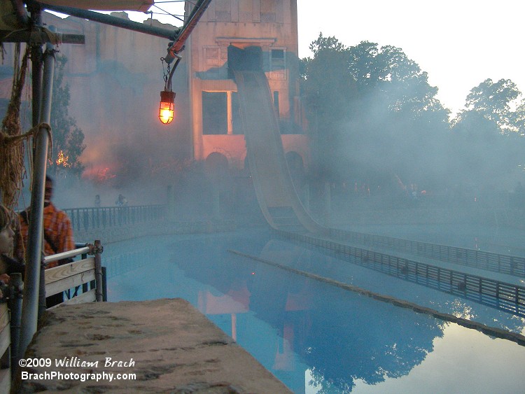 Fog settles over the Escape from Pompeii.  The ride's building is used for a haunted maze.