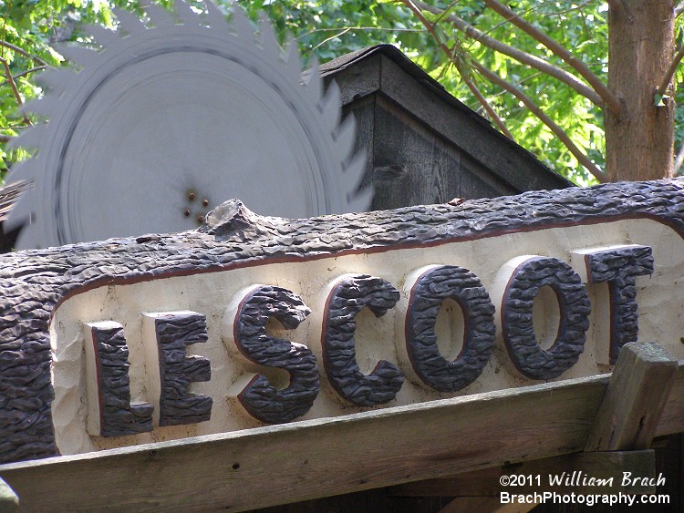 Entrance sign for Le Scoot features a rotating saw blade.