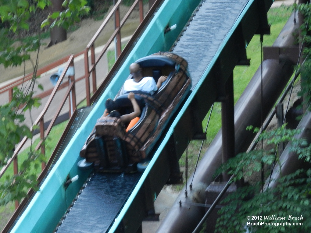 Boat going up the lift hill of Le Scoot.