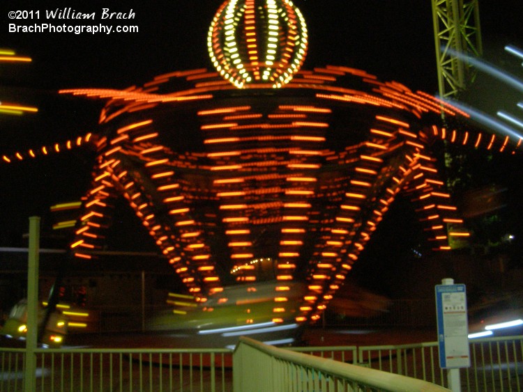 Apollo lit up in orange lights while in motion.