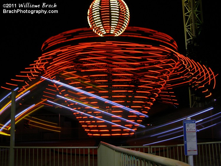 Apollo in motion lit up in orange lights.