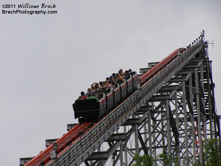 Red train going up the lift hill.