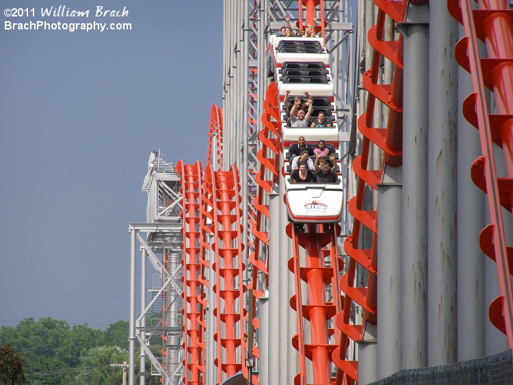 Red train going over the bunny hills.  Check out all those hands up in the air!