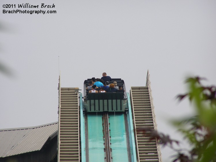 Boat cresting the lift hill.  All of those riders will be soaked in less than a minute!