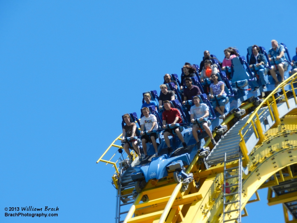 Skyrush riders going over the lift hill and into the first drop.