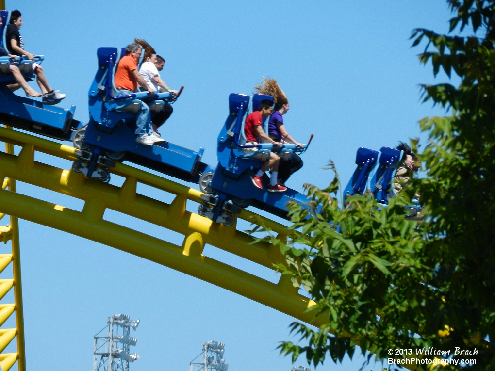 Wild and crazy Skyrush riders taking a spin on the coaster.