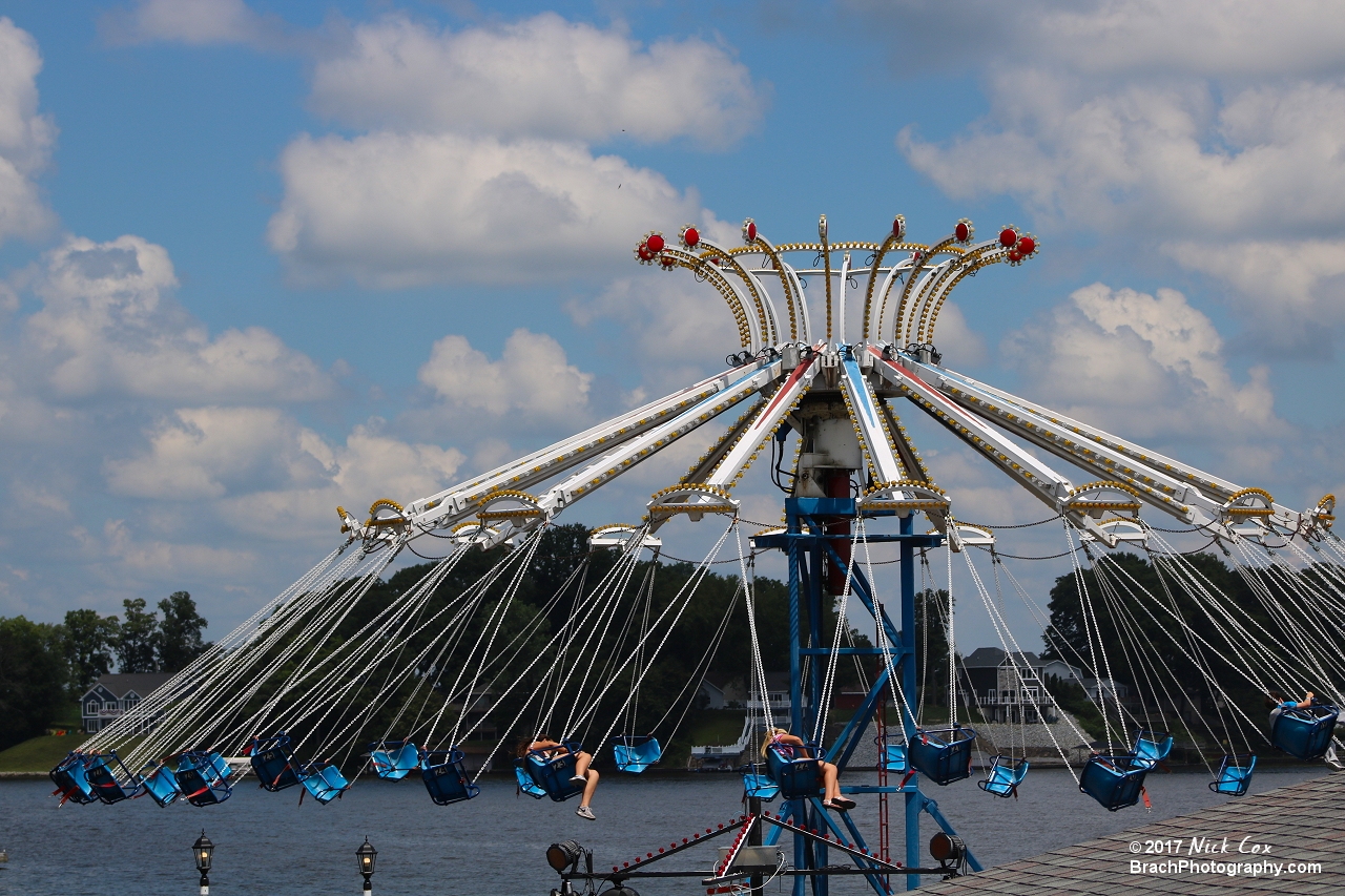 Swings flying over the water.