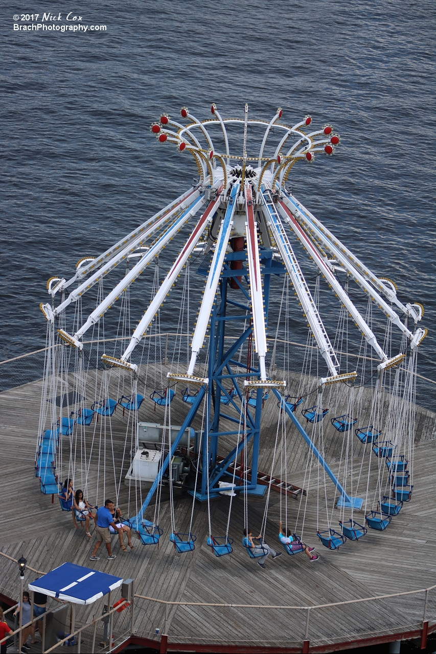 Swings flying over the water.