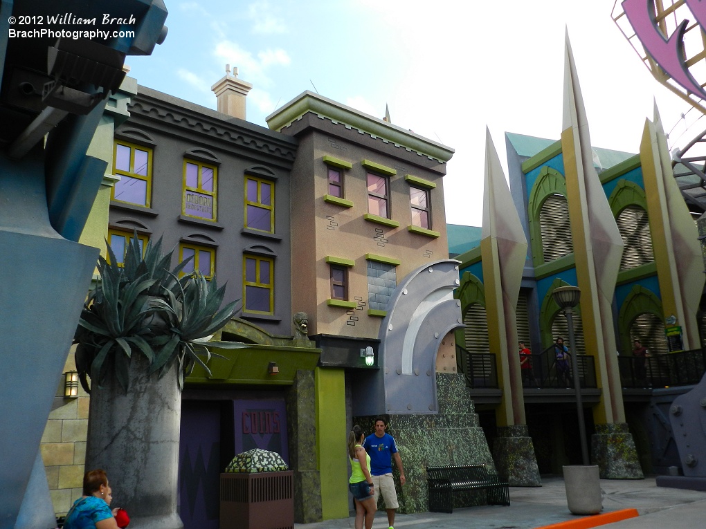 Looking at the buildings surrounding the ride's entrance.