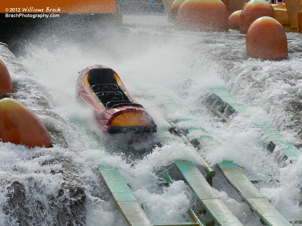 Empty log going through the water sprays.