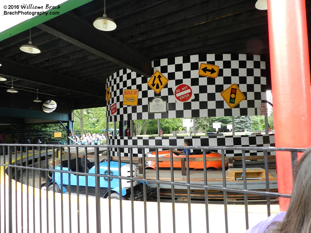 Looking inside the station.  The orange car is passing through the station to the second half of the ride.