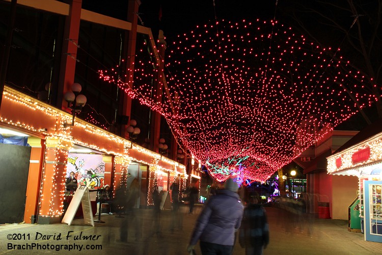 Red lights rain in walkway.