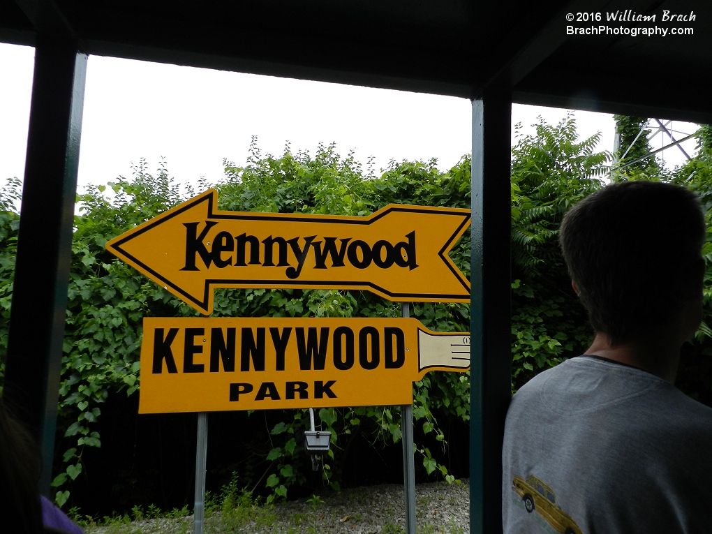 Signs directing gurests to the park.  The top arrow is their current logo today.