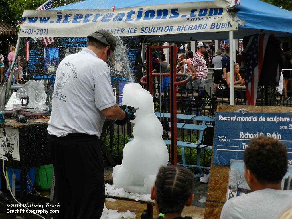 Carving an Olaf sculpture.