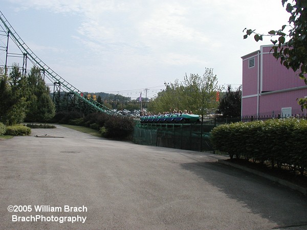 Phantom's Revenge has an odd straight stretch of track between the first and second hills.  Here we see the green train rushing through the straight track.