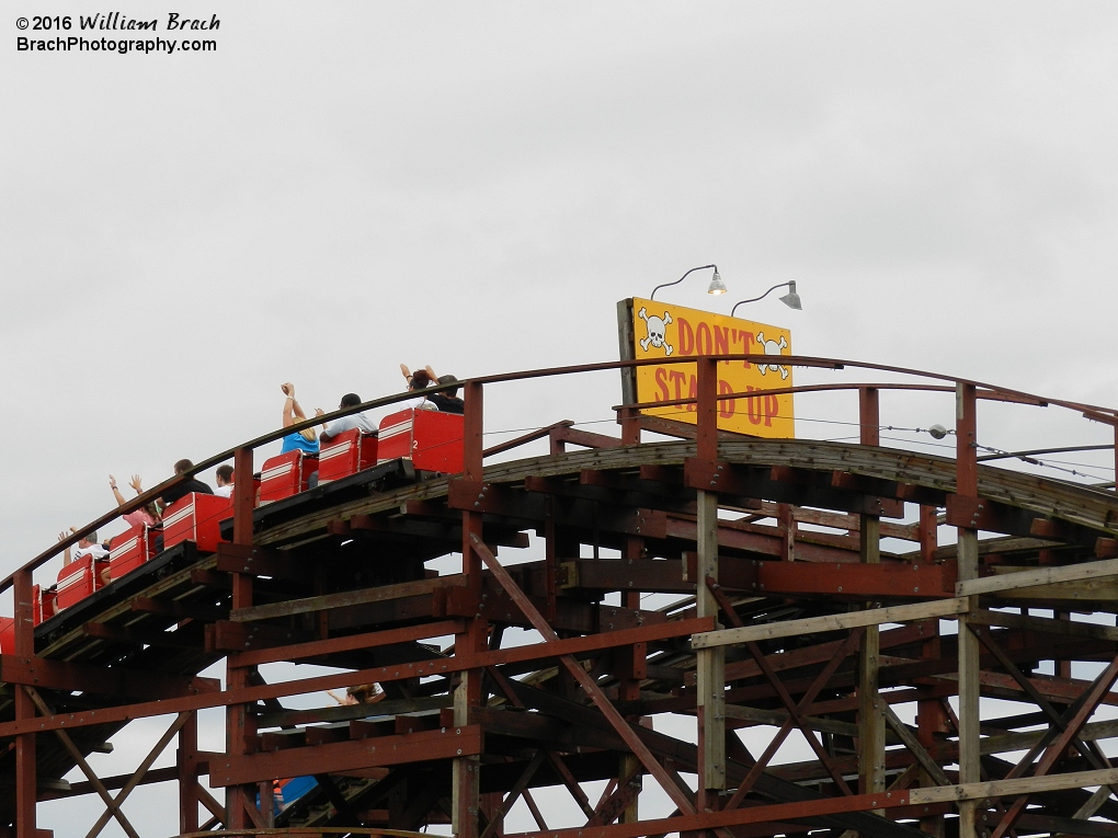 Red and blue trains going down the first drop.