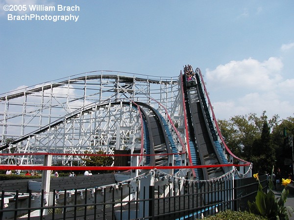 Designed in 1968 by Andy Vettl Sr. and John A. Miller.  Thunderbolt is unique because the lift hill is NOT immediately outside the station.   To start the ride, you drop into a ravine and turn around before you go back into the ravine before you reach the lif thill which is seen here.