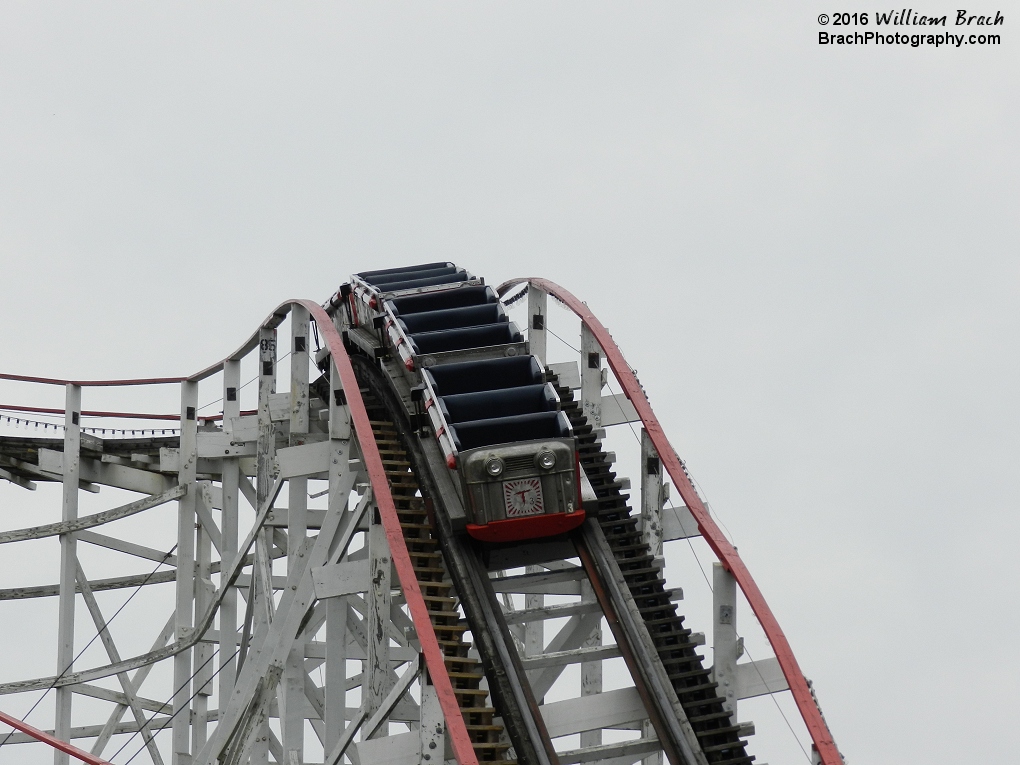 Red train was sent through the coaster several times to allow staff to add another train to the circuit.