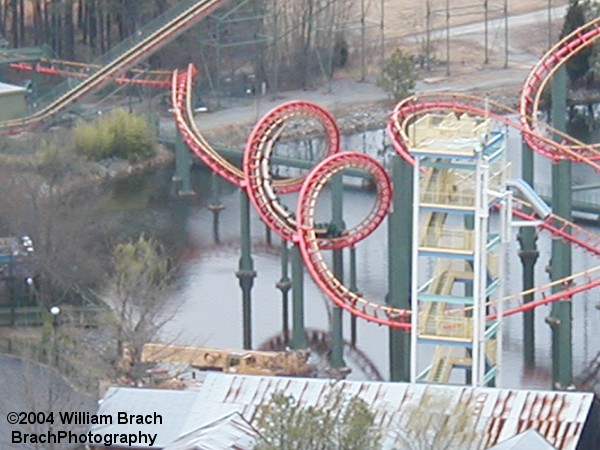 Digital zoom shot of the train running through the corkscrews.  This was taken BEFORE Italian Job (Backlot Stunt Coaster) was built.