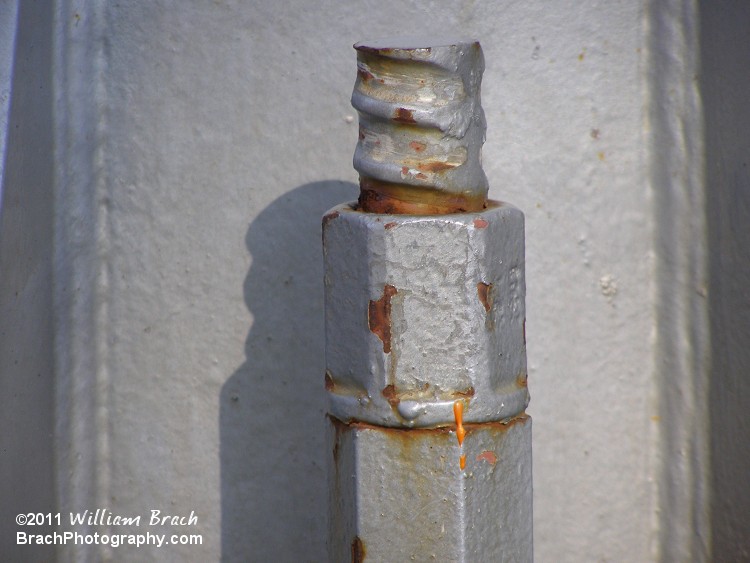 One of the many bolts securing the supports to the ground seen here in detail.