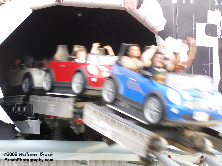 Backlot Stunt Coaster had multicolored trains up until the 2010 season.  For the 2010 season, the train cars were colored the same.