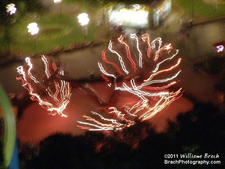 Looking at Tripple Spin at night from the Eiffel Tower.