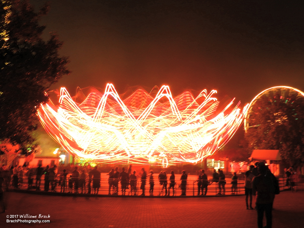 Bad Apple lit up in red lights for Halloween Haunt.