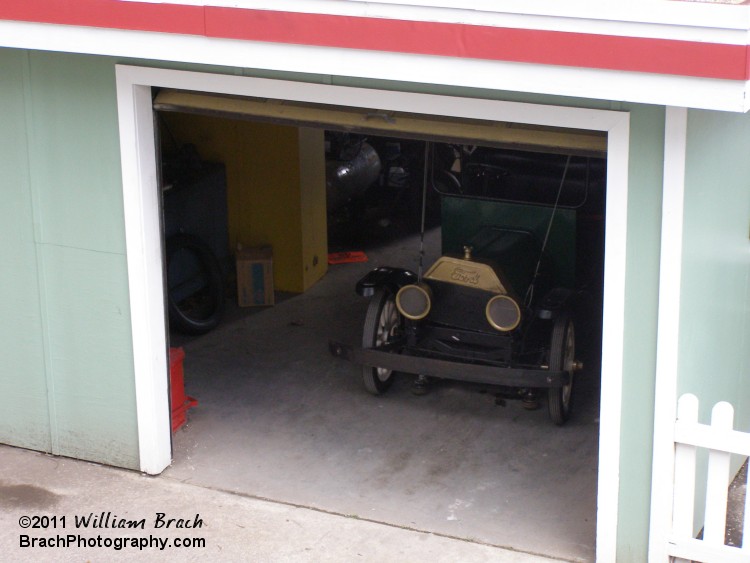 Green car in the garage.