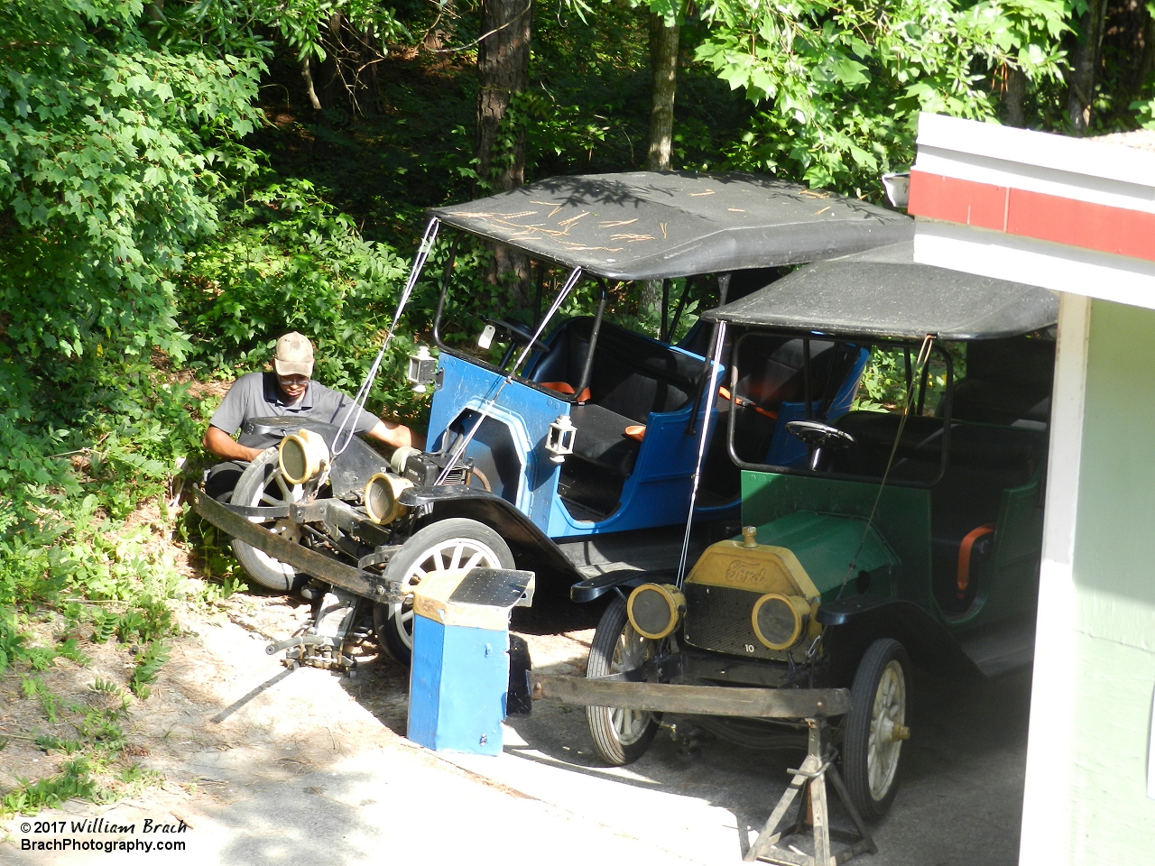 Maintenance guy working on one of the blue Tollway cars.