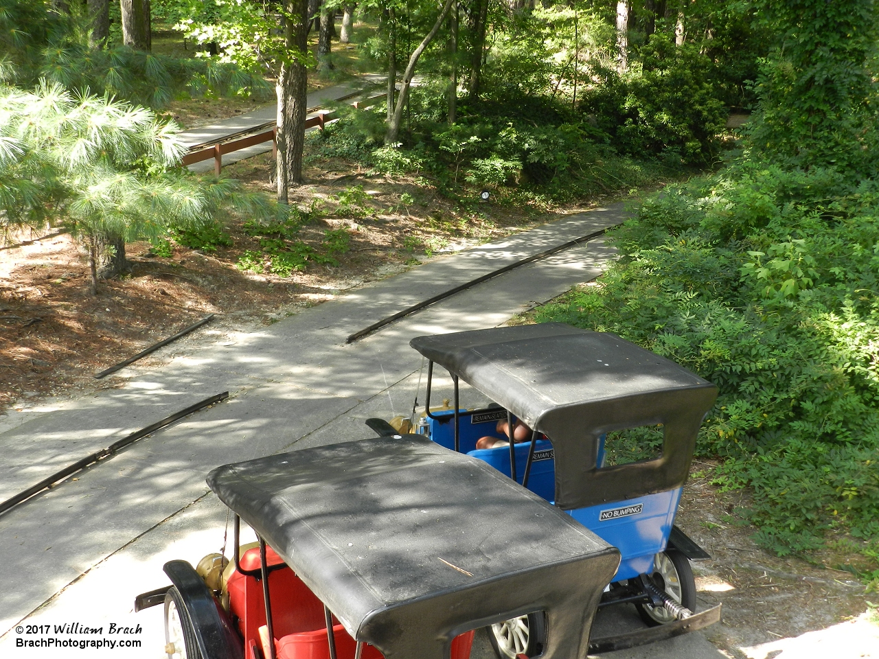 Ever wonder how the cars get on and off the track?  There's the answer.  The track portion outside of the garage gets removed for the cars to be added to the track.