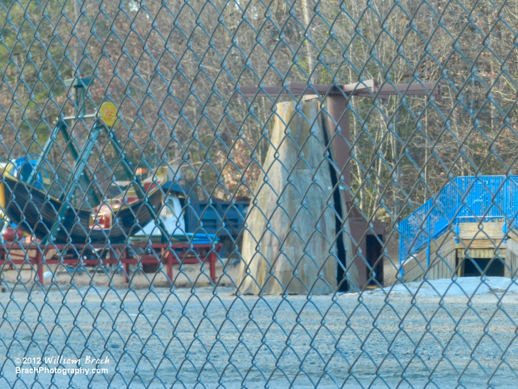 Various former Kidzville ride parts sitting in the park's boneyard.  L to R: Virginia Clipper (boat), Swing-A-Round (tree)m Cirginia Clipper Station (blue railings).