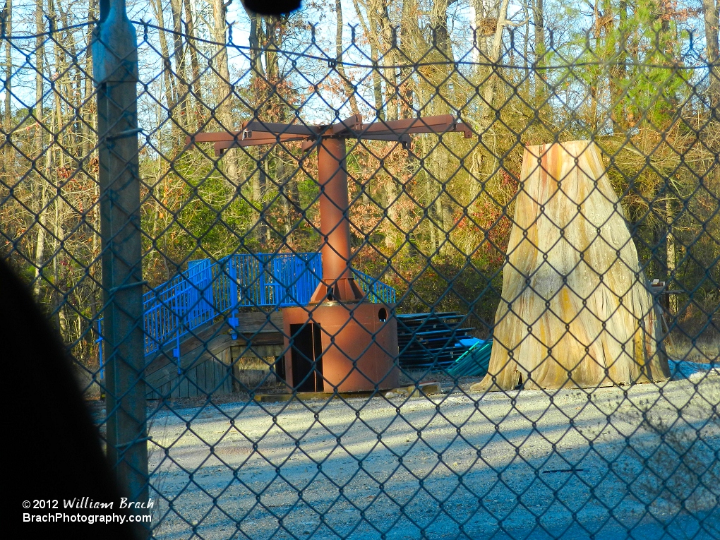 Swing-A-Round ride mechanism and ride cover "tree" seen sitting in the parks boneyard.