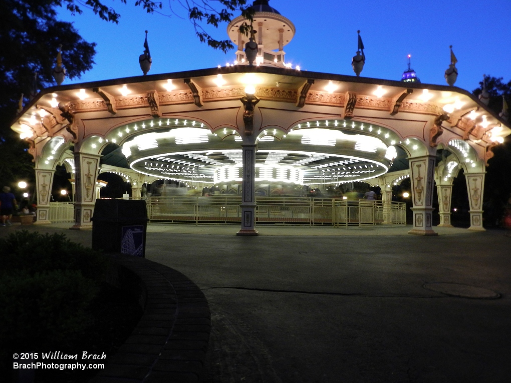 Looking at Kings Dominion's Carousel in motion at night.