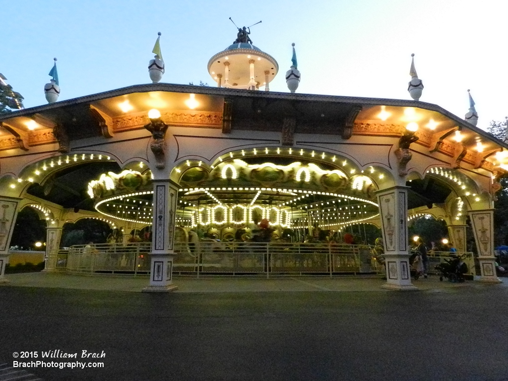 Carousel well lit at night.