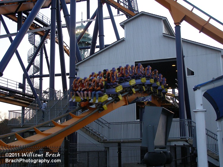 Train rolling out of the station and headed towards the lift hill.