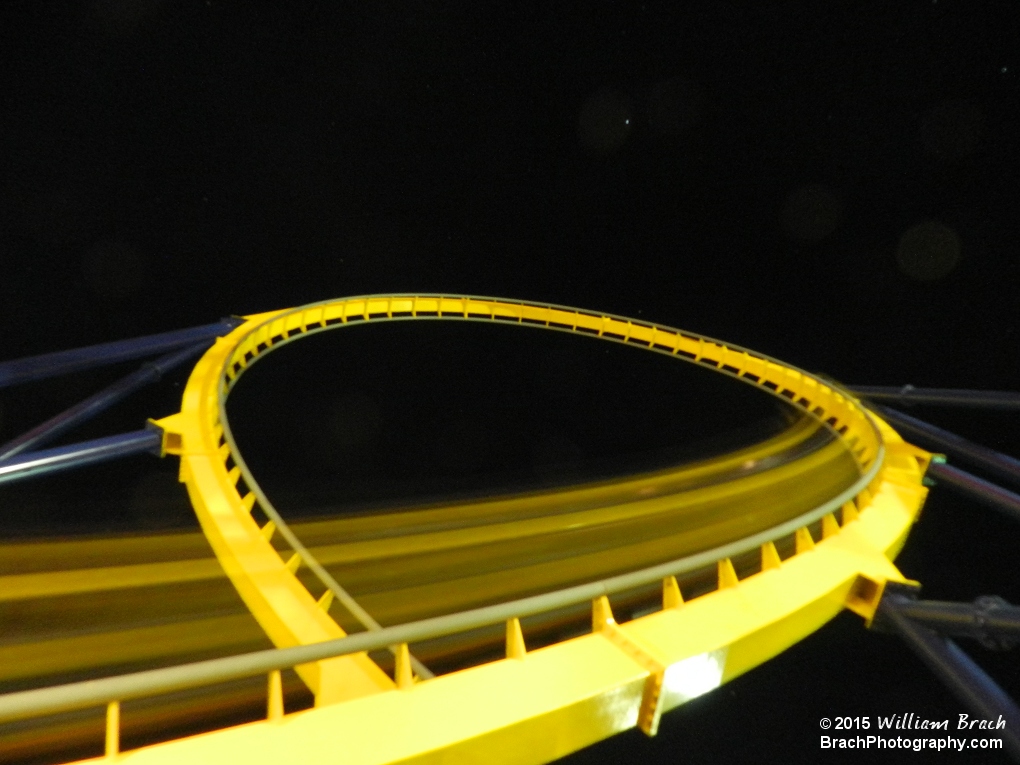 Train rushing through Dominator's vertical loop.