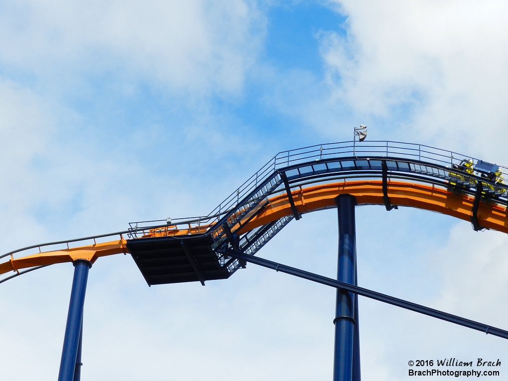 Looking at the top of Dominator's lift hill as a train climbs to the top of the hill.