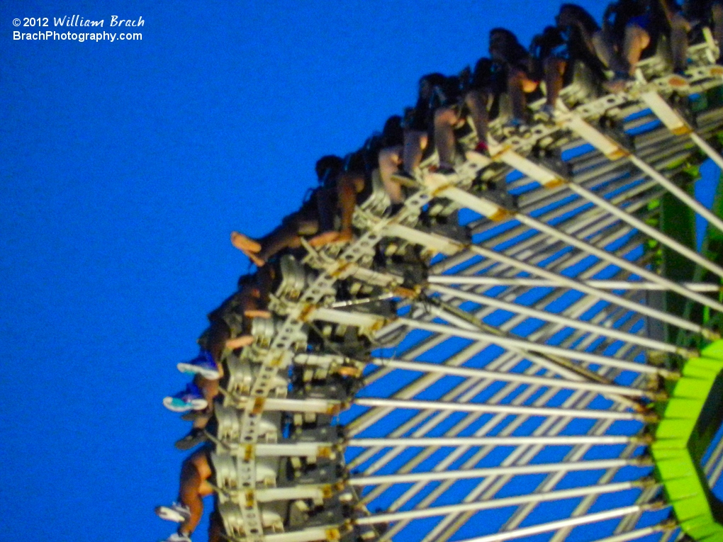 Looking up at Drop Tower at night.