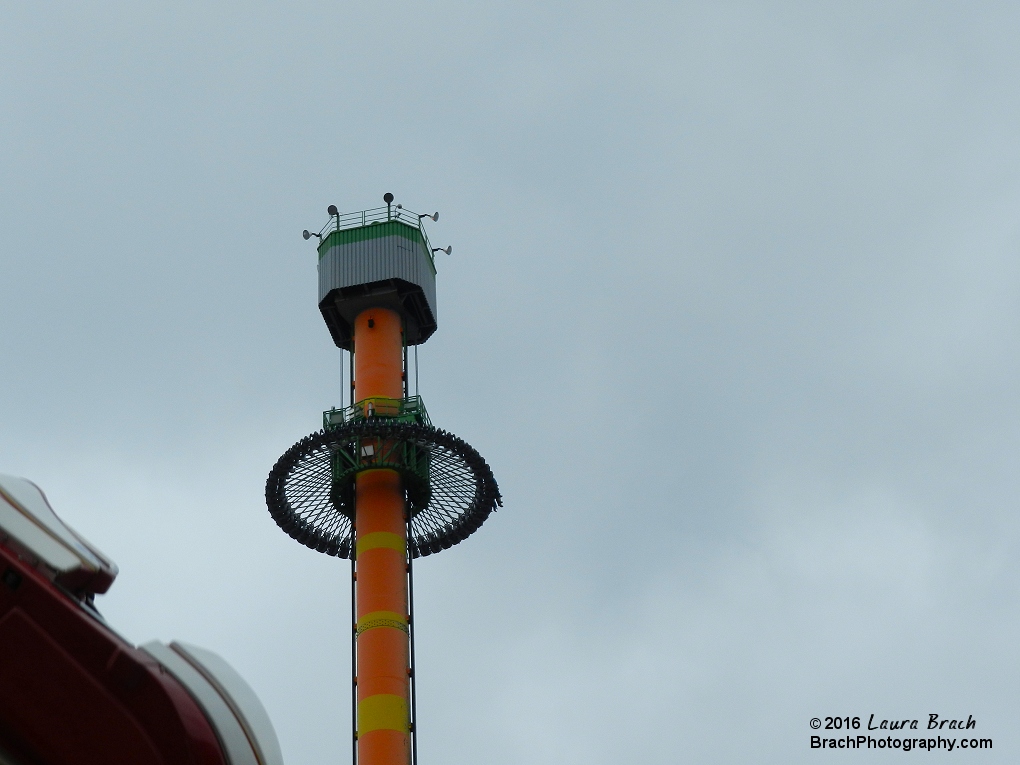 Drop Tower's gondola going up the tower.