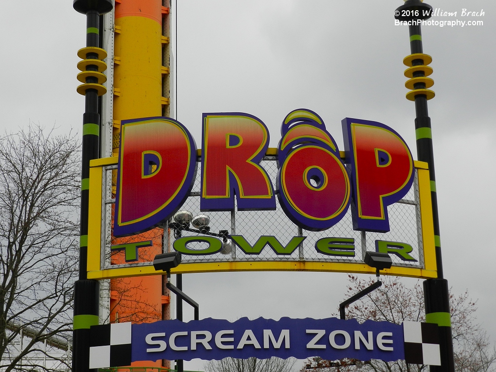 Drop Tower's plaza entrance sign.