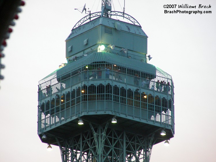 Looking at the people on the top observation deck.