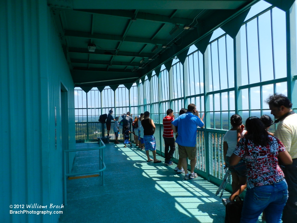 Checking out the action on the lower observation deck atop the Eiffel Tower.