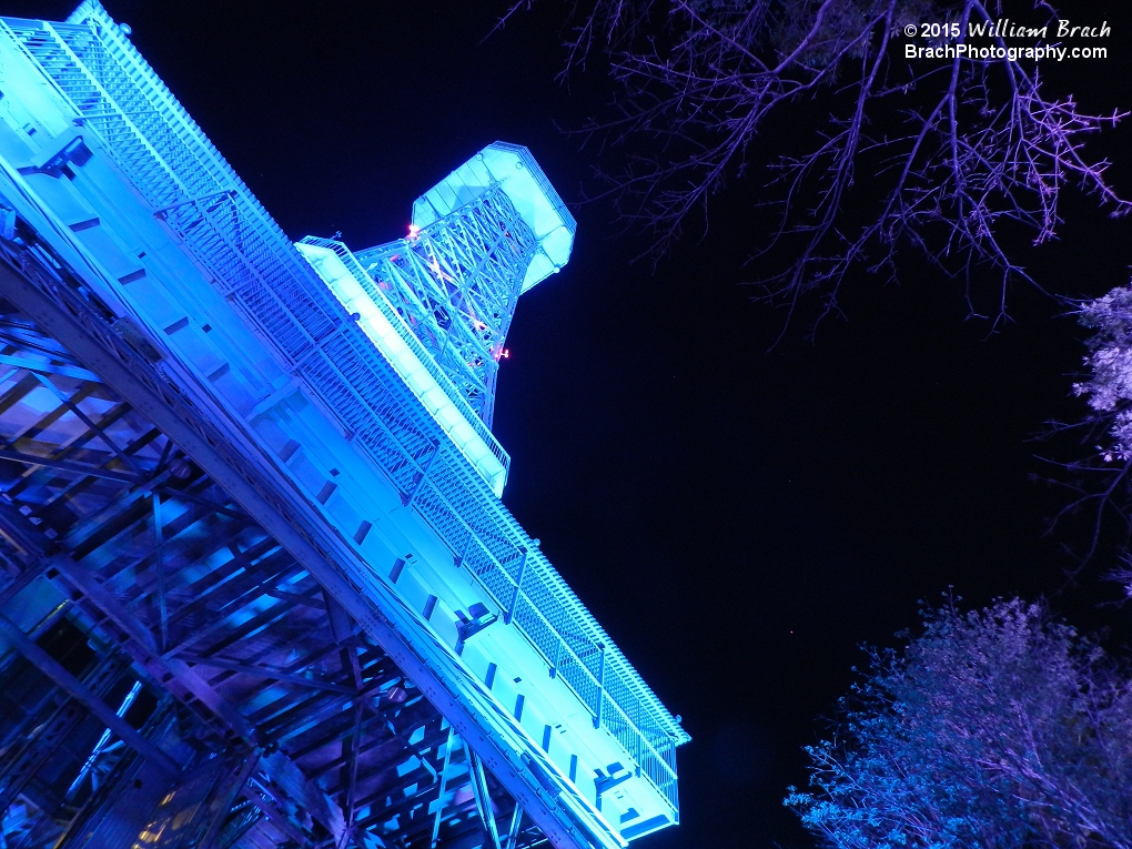 Well lit up in blue lights at night.