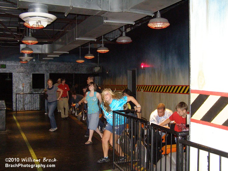 Riders exiting the train after their ride on Flight of Fear.