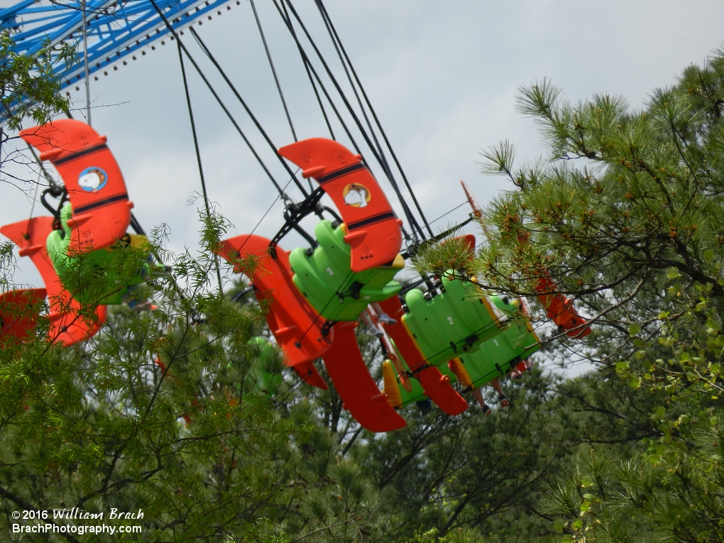 Flying Ace just at the top of the treeline on the other side of Planet Snoopy.