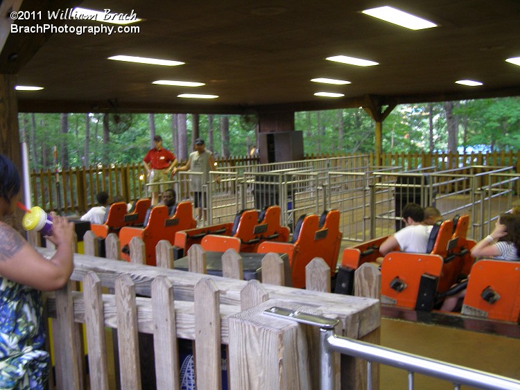 Grizzly's orange train loading up in the station.