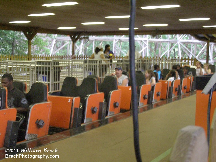 Orange train in the station.